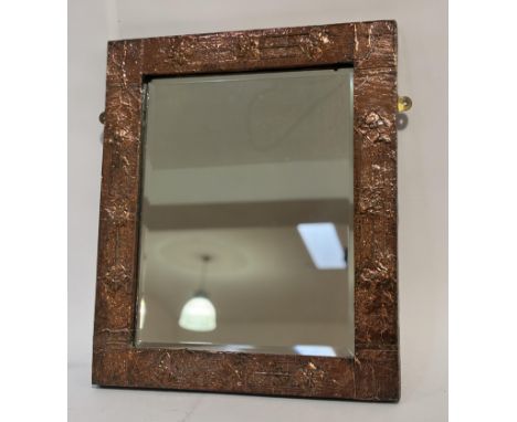 An Art and Crafts period, copper hammered finished decorative mirror. (54cmx63cm)