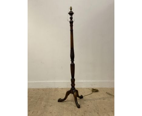 A 1920's mahogany standard lamp in the Georgian style, standing on three splayed supports with ball and claw feet. H156cm.&nb