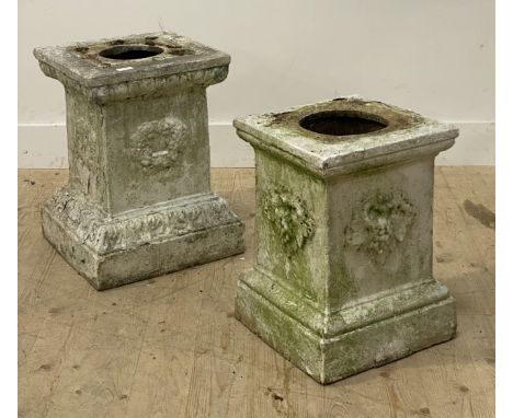 A matched pair of terracotta garden plinths, first half of the 19th century, each decorated with floral motifs. larger H52cm,