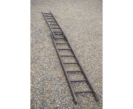 A wooden eight rung extending ladder. 