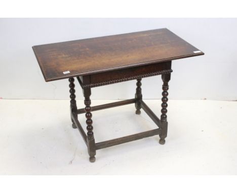 17th century style Oak Side Table raised on bobbin supports and united by square stretchers, 106cms long x 73cms high 