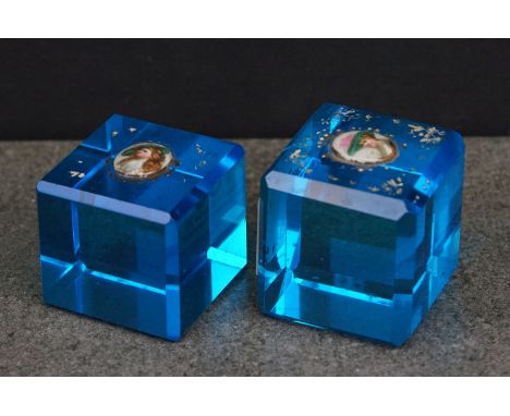 Two 19th century Faceted Blue Glass Cube Paperweights, each set to the top with an oval porcelain panel hand painted with a p