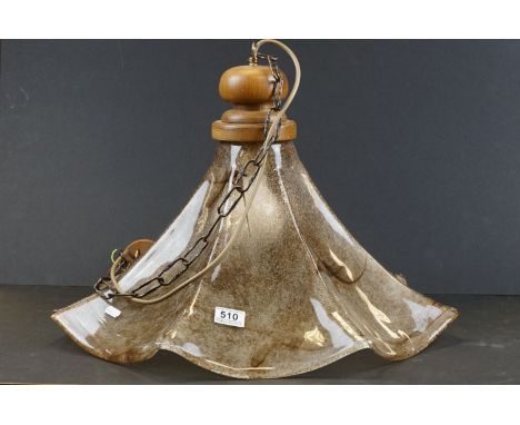 A decorative art glass ceiling lamp with wooden fittings. 