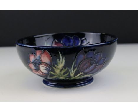 Moorcroft Bowl in the Anemone pattern on a dark blue ground, green impressed marks to base including an arrow and the initial