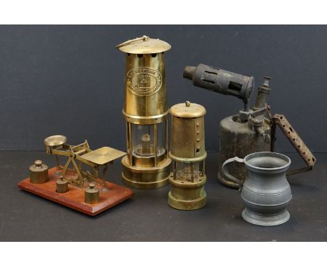 A box of mixed collectables to include Post office scales, pewter tankard, brass miners lamp's and a brass blowtorch. 
