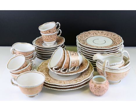 19th century part Tea Service decorated with gilt scrolling foliage and a peach coloured border comprising thirteen plates, n