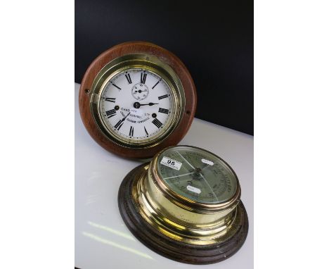 Chadburn's Ltd of Liverpool Brass Cased Bulk Head Clock, the white enamel face with Roman numerals and seconds dial, with key