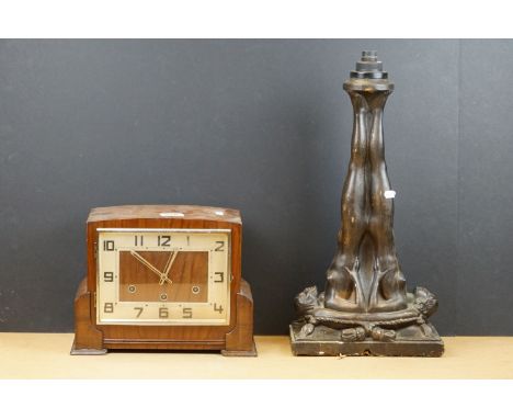 A wooden cased chiming mantle clock together with an Art Deco style figural table lamp. 