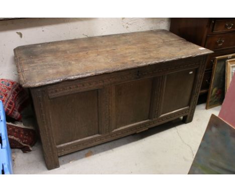 18th century Oak Three Panel Coffer with hinged plank top opening to a candle shelf, raised on stile feet, 114cms long x 52cm