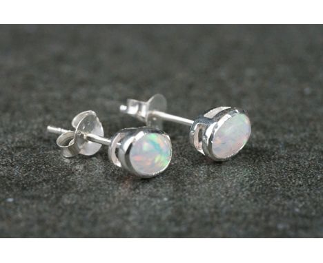 Pair of silver and opal stud earrings 