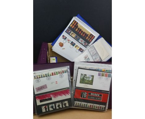 A large collection of first day covers and presentation packs contained within six folders. 