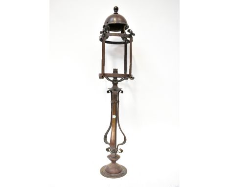 An early 20th century ostler brass mule post lamp (lacking shade), previously from a bank in Preston, height 92cm.