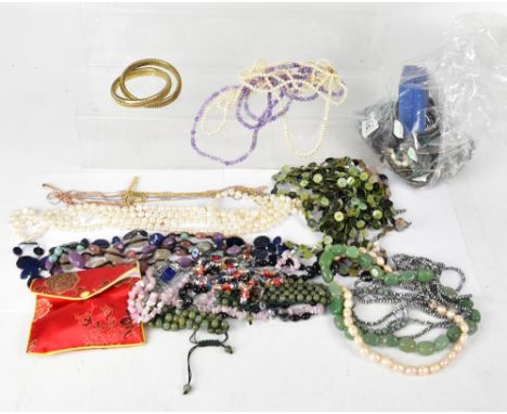 A large quantity of costume jewellery to include various necklaces, some with semiprecious stones, rough cut amethysts, turqu