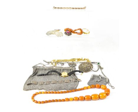 Various items of costume jewellery to include an amber-style necklace with forty-one graduated beads, an amber-style disc pan