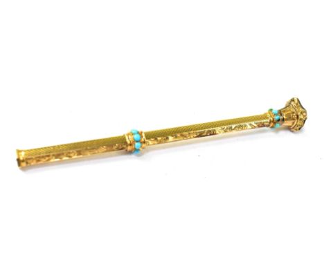 An early 20th century gold-coloured metal mechanical pencil with seal top engraved with indistinct initials, the stem decorat