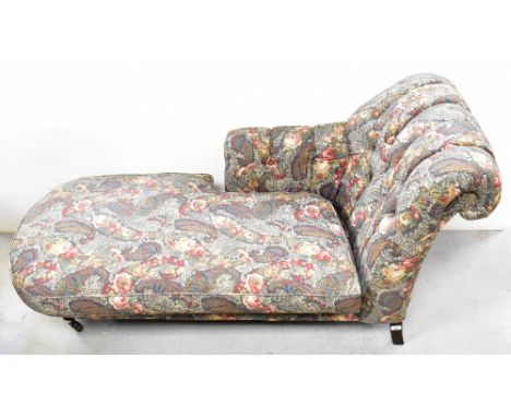 A reproduction Victorian-style chaise longue with button upholstered scrolling arm, upholstered in a Paisley-style floral fab