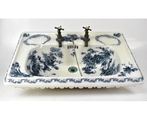 JOHNSON BROS (HANLEY) LTD; a Victorian blue and white decorated wash basin, with pair of built-in scalloped soap dishes to th