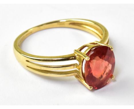A 9ct yellow gold ladies' dress ring set with oval facet orange coloured stone, possibly Andesine, size R, approx 2.7g.
