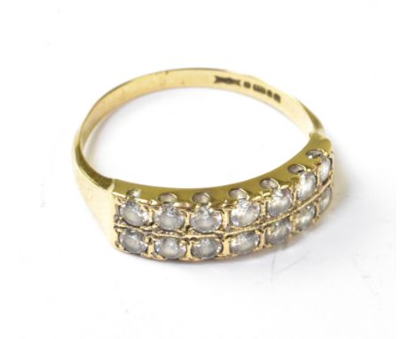 A 9ct gold double row half eternity ring, with two rows of seven white stone inset claw mount stones, size R. CONDITION REPOR