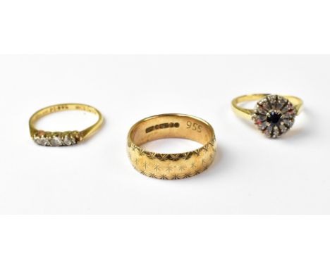 A 9ct yellow gold wedding band, size N, approx 3.9g, an 18ct yellow gold ring set with three white stones, size K, approx 2g,