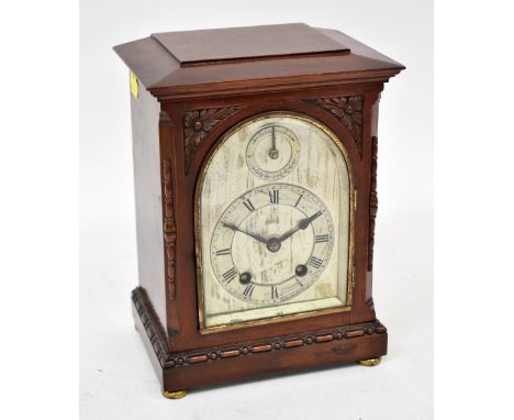 ASTRAL OF COVENTRY; an oak cased mantel clock with domed silvered face, the silvered bezel set with Roman numerals, smaller d