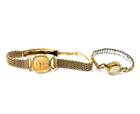 TISSOT; a ladies' 9ct gold wristwatch, the gilded face set with dot numerals, on a 9ct yellow gold brick link bracelet strap,