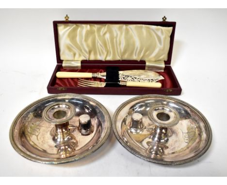 A pair of large electroplated chamber sticks, each engraved with initials 'LL', diameter 19cm, and a cased set of fish knife 