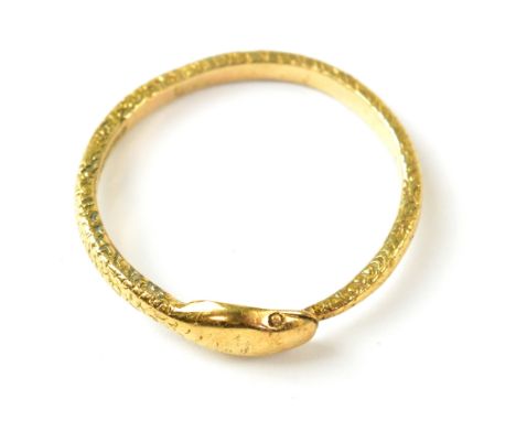 A 9ct gold ring depicting a snake devouring its tail, forming the ring, with textured body replicating scaled skin, hallmarke