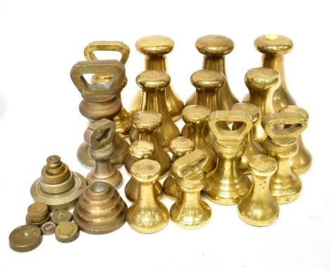 A large quantity of vintage/antique brass weights to include two styles of bell weights, the heaviest being a 7lb Avery examp