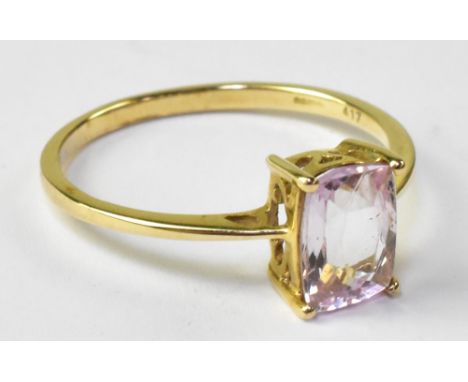 A 10ct yellow gold ladies' dress ring, with single emerald cut pink stone, size R. CONDITION REPORT Approx 2g.