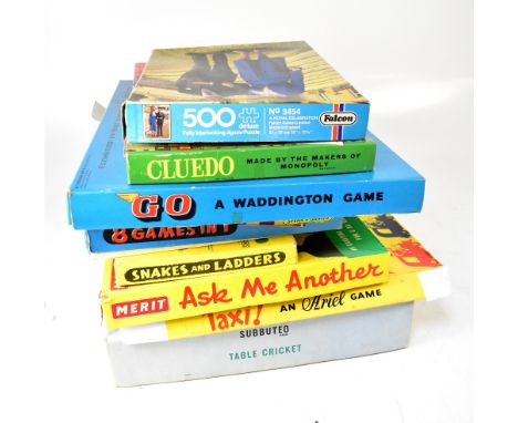 A quantity of vintage boardgames and jigsaw puzzles to include Subbuteo Club Edition, Taxi!, Ask Me Another, Go, etc.