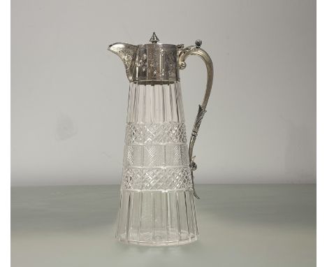 An&nbsp; Edwardian claret jug of flared crystal form with epns engraved mount and cone finial and C scroll handle to side wit