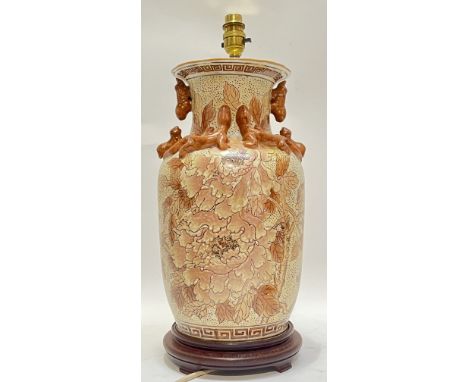A Chinese style lamp base decorated with flowers in raised enamel, on modern hardwood base (h- 48cm)