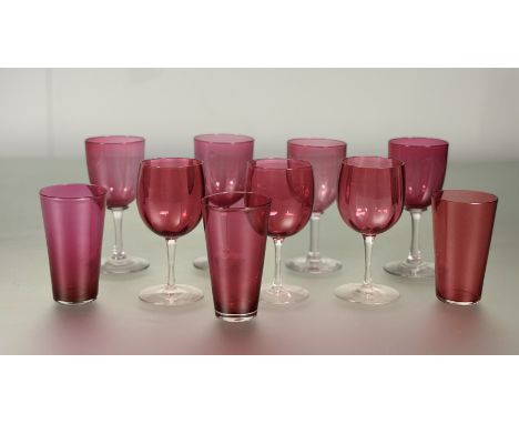 A group of Edwadian vintage granberry glass to include: three tapered tumblers H x 10cm, a set of three fluted wine glasses H