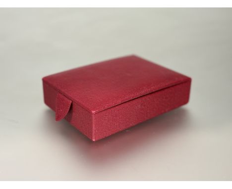 A Smythson of Bond Street London red grained leather Travel Tray jewellery box of rectangular shape with snap closure and faw