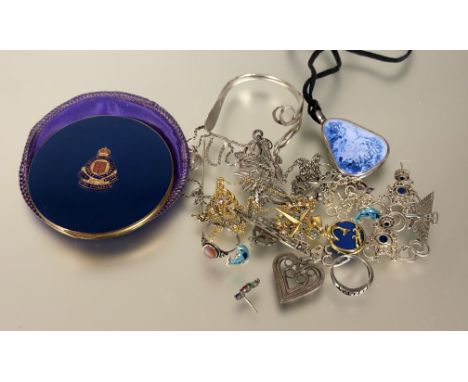 A collection of silver and metal costume jewllery to include a heart shaped pendant L x 3cm, a silver childs christening fork