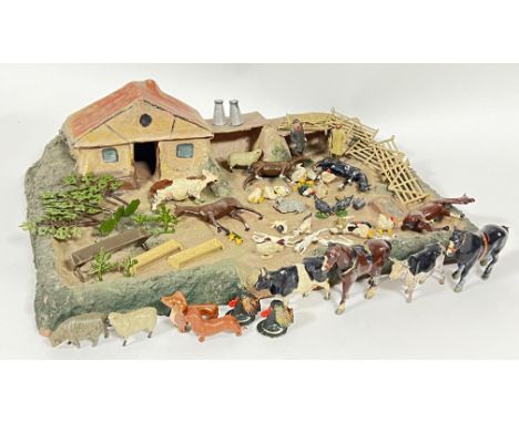 Vintage toys, a papier mache model farm together with various animal figures and scenery accessories including horse, figures