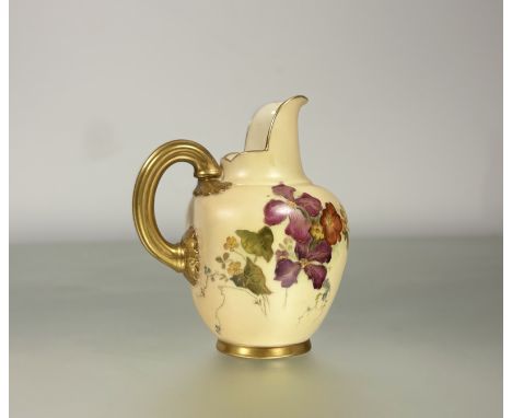 A Royal Worcester caneware blush milk jug decorated with hand painted floral sprays with rope pattern gilt handle to side pri