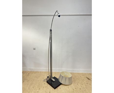 A polished stainless steel arc style floor lamp with black marble base, with silvered shade, requiring re-wiring (h. 223cm x 