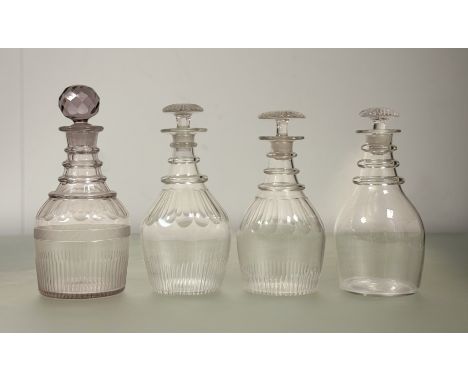 A early 19thc lead crystal quadruple ring neck mallet shaped decanter with slice and thumb cut decoration and faceted ball pa