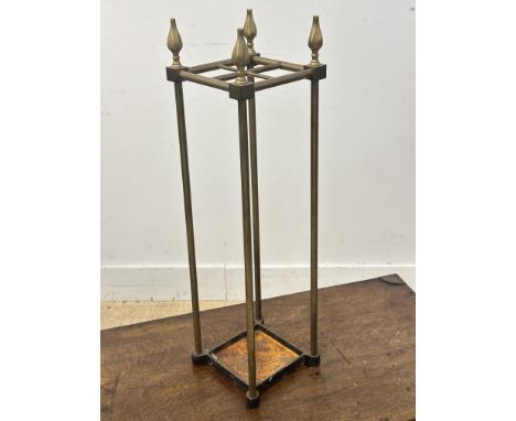 A cast iron base brass four division stick stand (h.66cm x 18cm x 18cm)