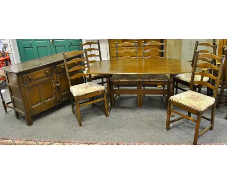 An Ercol dining table with four dining chairs, one carver and conforming sideboard (7)