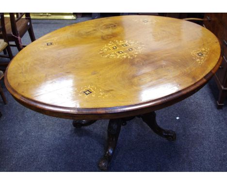 A Victorian walnut breakfast table oval top quarter veneered inlaid with flora, four turned supports,under finial, cabriole l