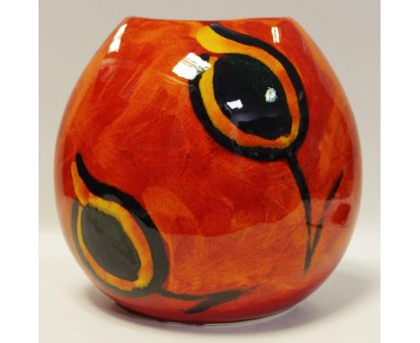 A large Poole Pottery purse vase decorated with an orange glaze, H26cm, W27cm