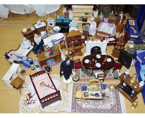 A quantity of Victorian style doll's house furniture including a plaster Adams style fireplace, gateleg dining table, kitchen