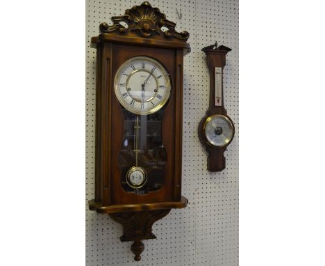 A contemporary Astra wall clock, twin winding holes, Roman numerals, pendulum; a Comitti, London barometer/thermometer (2)  