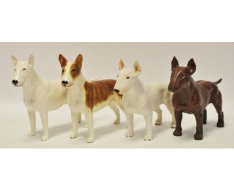 Four model Bull Terriers including a near pair of CH Romany porcelain examples; two resin examples