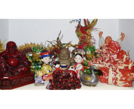 Oriental Objects - a substantial resin model of a seated Buddha 27cm height; another of a pig on a bed of coins; a large foun