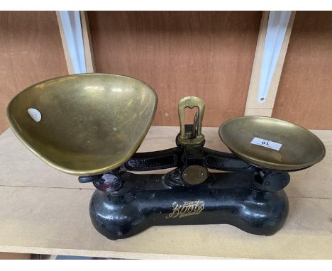 A SET OF VINTAGE BOOTS WEIGHING SCALES WITH BRASS PANS 