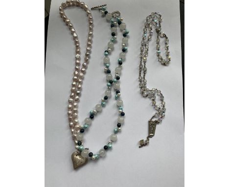 THREE BEAD NECKLACES ONE PEARLISED WITH SILVER METAL HEART PENDANT, WHITE AND TURQUOISE BEADS WITH HEART CLASP, AND A CRYSTAL